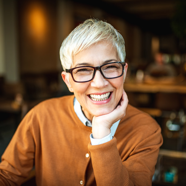 mature woman in glasses smiling